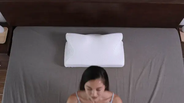 woman using Ergo Z pillow in bed
